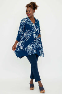 Side view of model twirling in the Laney Blouse, highlighting flowy silhouette