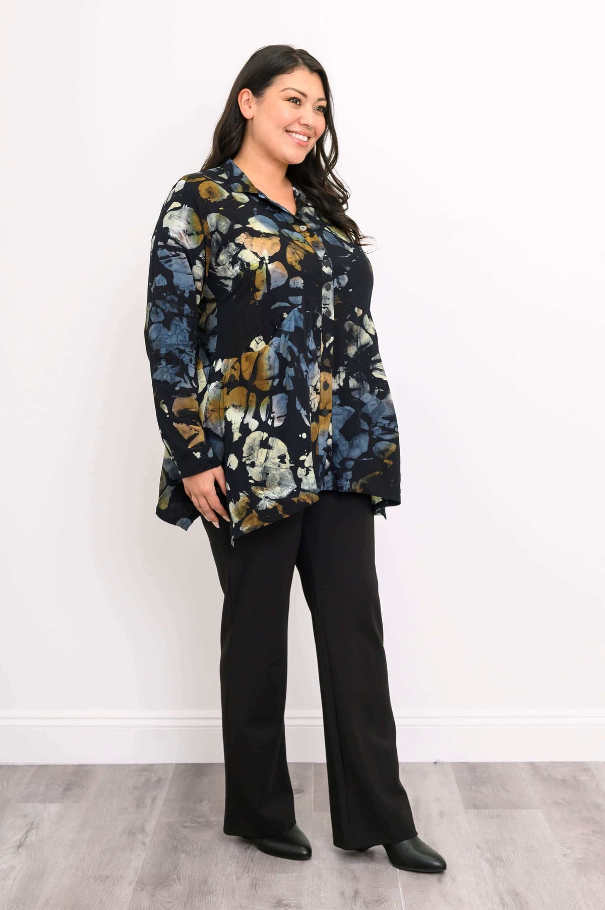 Woman in Laney Blouse Night Bloom, angled side view showing drape