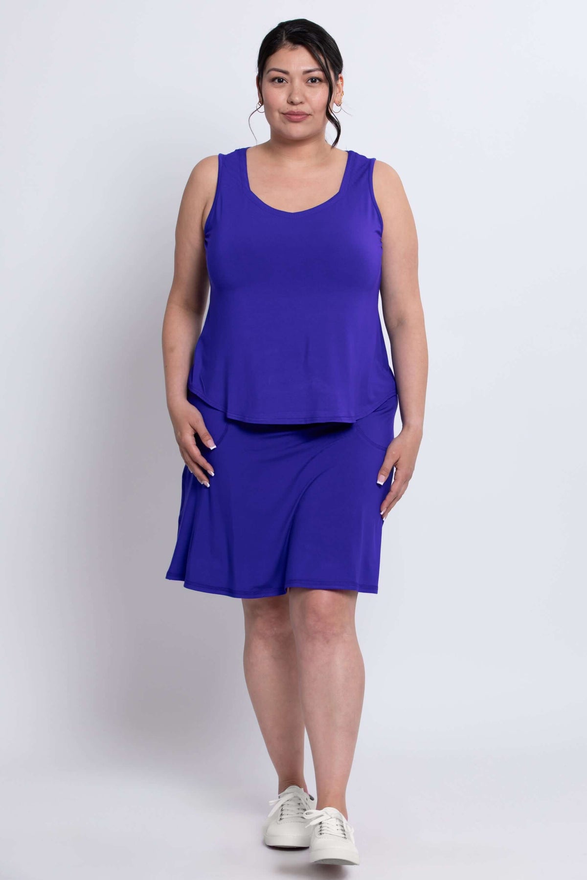 Model in royal blue Magna Skort and tank, standing facing forward