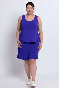 Model in royal blue Magna Skort and tank, standing facing forward