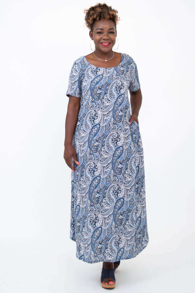 Front view of woman wearing blue paisley Martha maxi dress with pockets