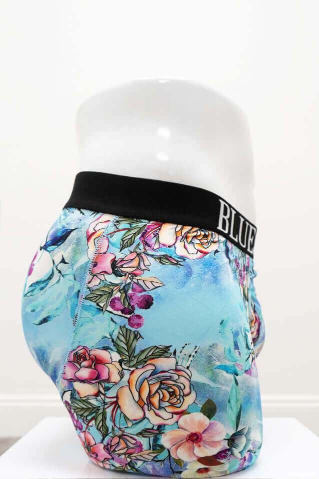 Men's aqua floral boxer briefs, right side view with vivid flowers