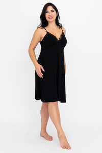 Front view of the black Mina Slip Dress with lace trim.