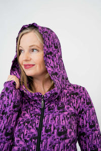 Close-up of model with hood up in Seymour purple print hoodie