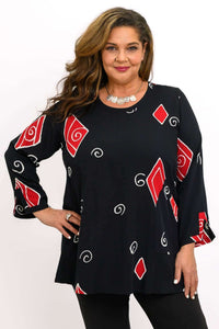 Model wearing the Palace Blouse with red geometric swirl accents and scoop neckline