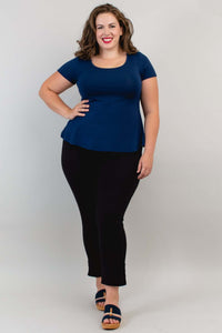 Model in navy Kim Cap Top and black pants walking forward