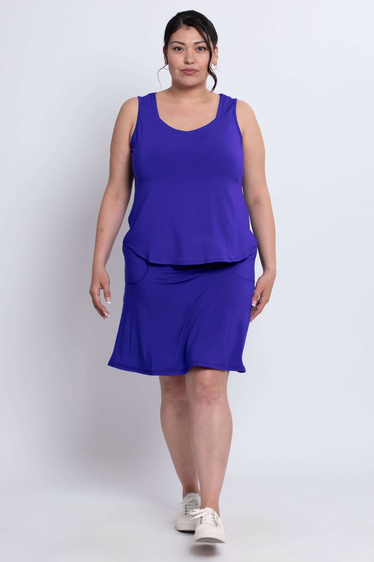 Model walking in royal blue Magna Skort and tank, front view