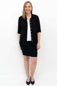 Model wearing Jonelle black pencil skirt styled with black blouse and heels