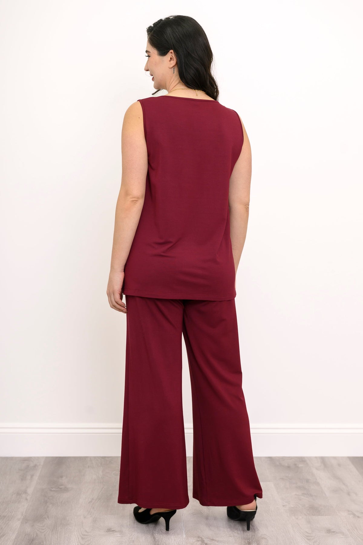 Rear studio shot of a wine red bamboo French terry tank top with a clean straight-cut hem.