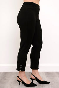 Side view of highwaisted black pants with elastic waistband and button detail at the hem