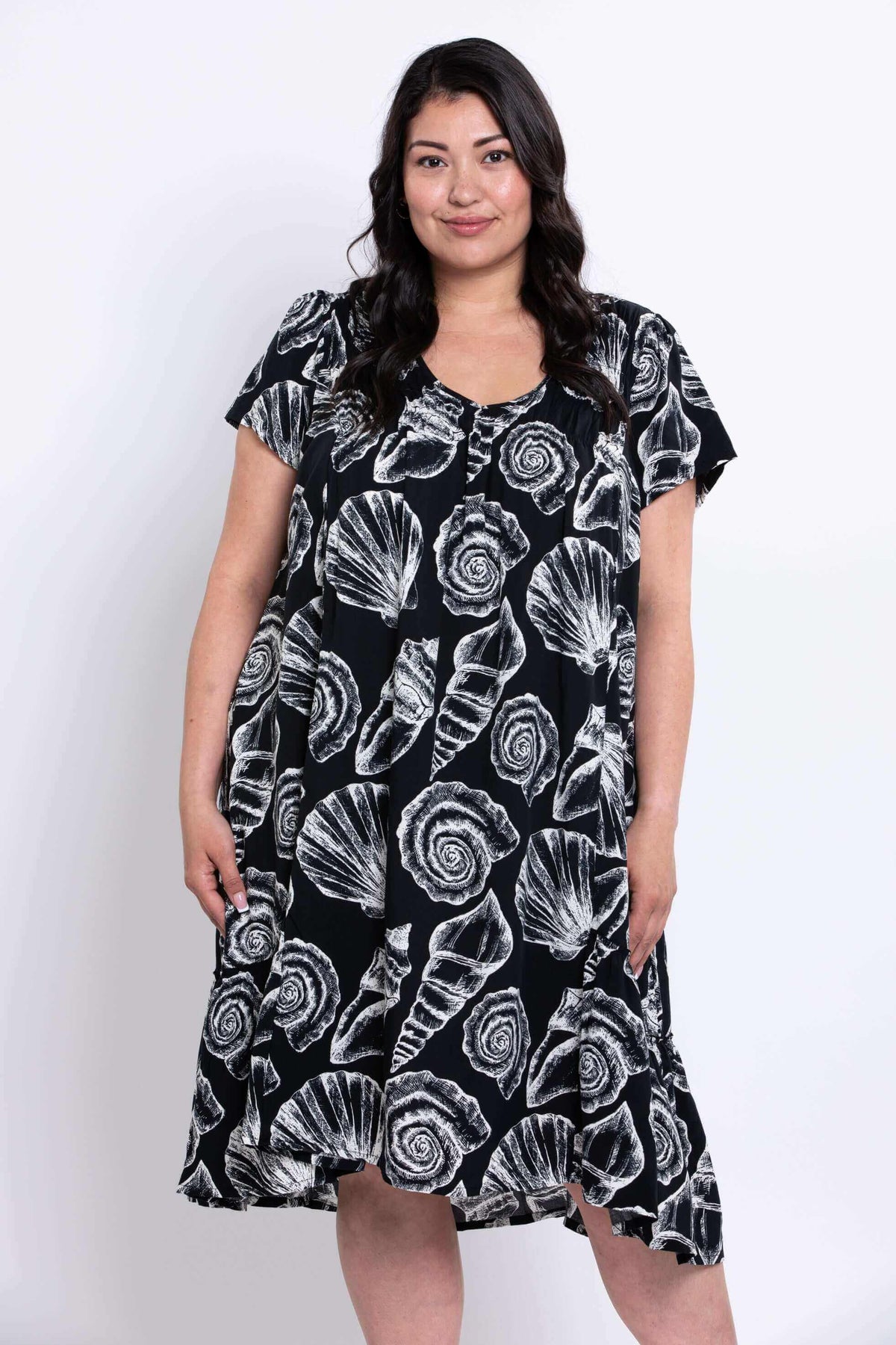 Closer front view of Noosa Dress showing white shell pattern on black fabric