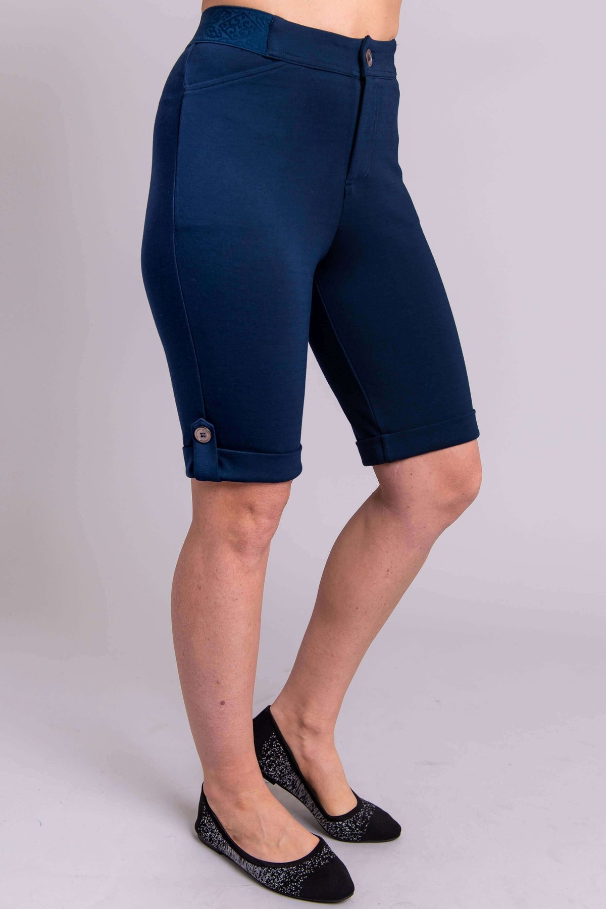 Side view of Norma Short in navy blue showing pockets and tailored fit