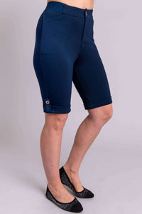 Side view of Norma Short in navy blue showing pockets and tailored fit
