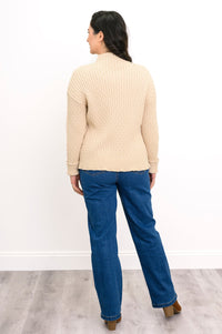 Rear view of a cream mock neck cotton pullover, highlighting its comfortable, mid-hip length classic fit.