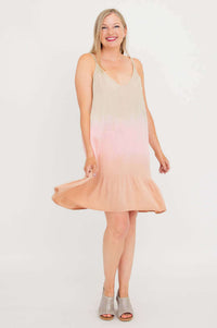 Woman twirling in an ombre sleeveless V-neck boho dress with adjustable straps