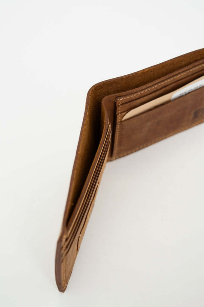 Angled open view showing card slots in a brown leather wallet