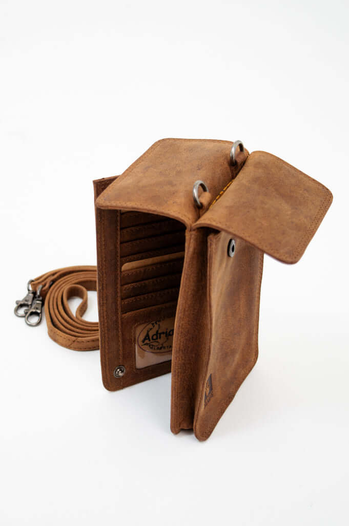 Open brown leather wallet with card slots and detachable strap