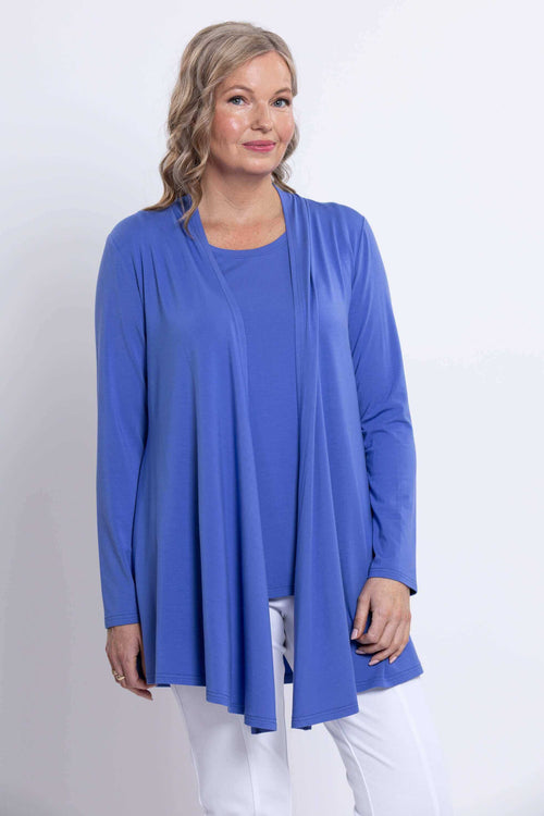 Front close-up of model wearing a light blue open front shrug and a matching top underneath