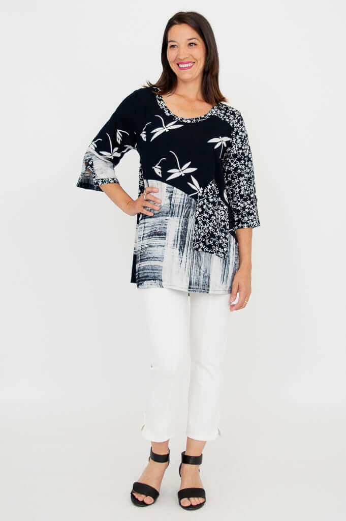 Woman posing in Palace Blouse, showcasing mixed patterns, front angle