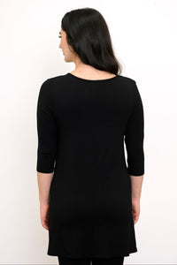 Back view of woman wearing plain black tunic with 3/4 sleeves