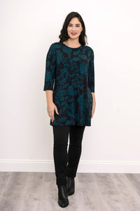 Model posing in a teal leaf pattern bamboo tunic, highlighting the flattering hip-covering length.