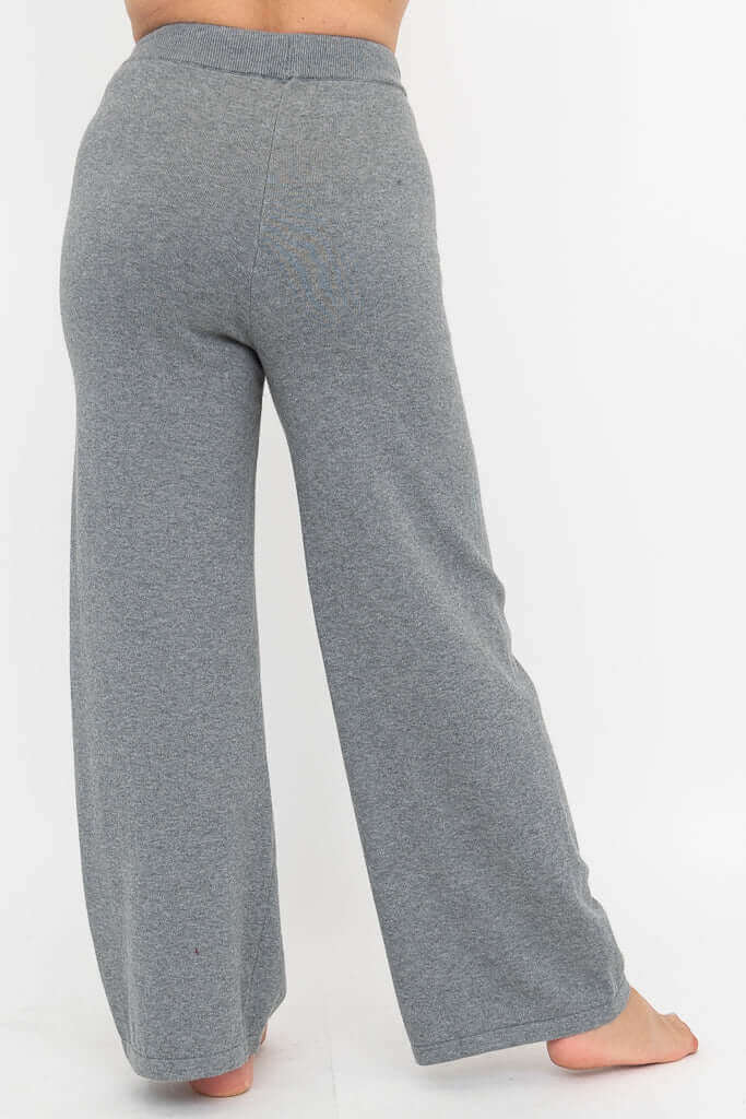 Rear view of grey lounge pants highlighting wide legs and comfortable fit