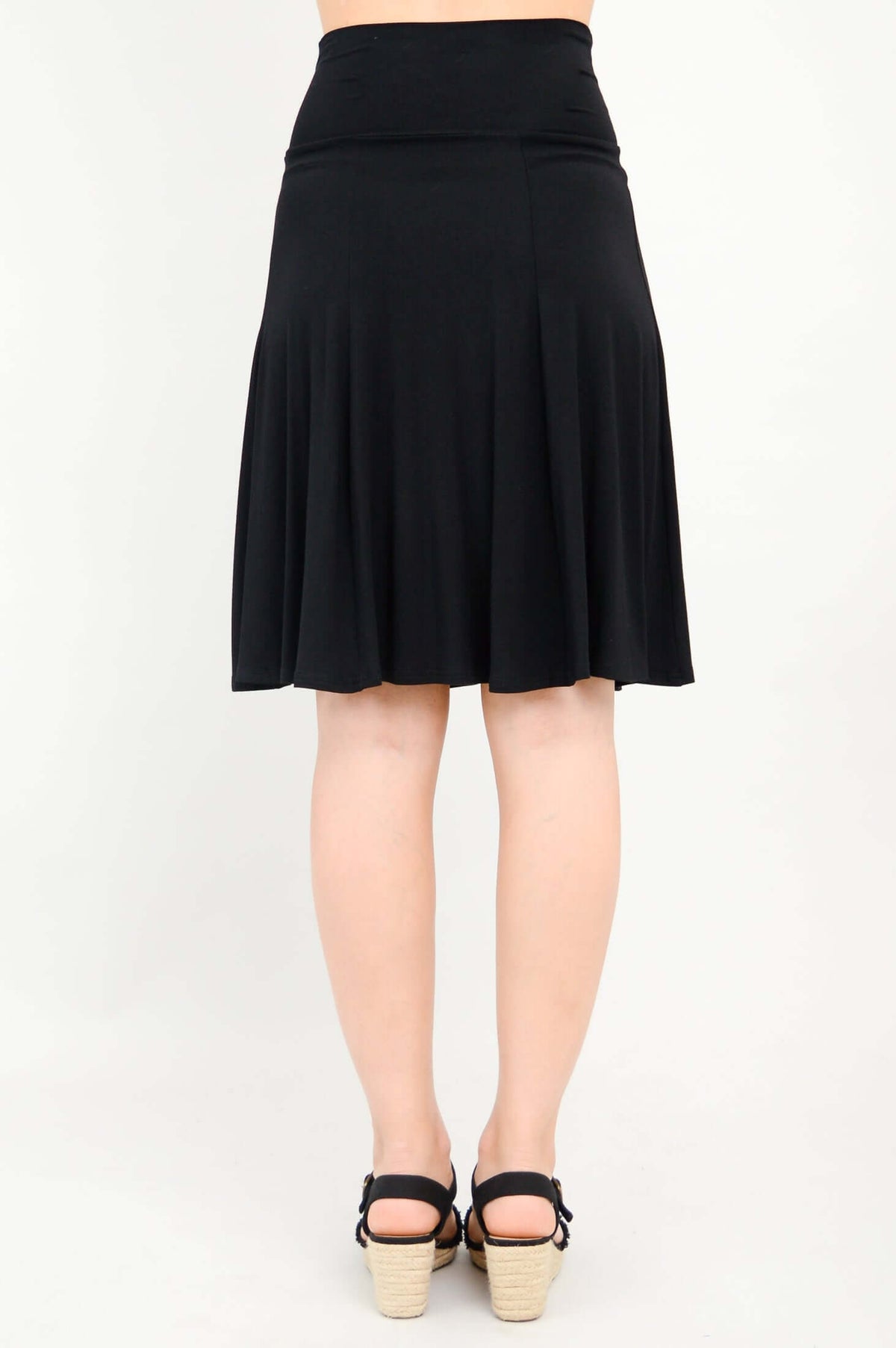 Rear angle of Aly fit and flare black skirt with wide waistband