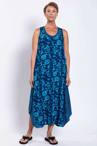 Woman modeling Ari blue floral tank dress, relaxed fit and midi length hem