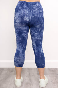close-up back view of blue tie dye legging featuring capri-length and elastic waistband
