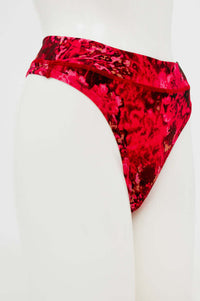Side view of red and pink patterned high-rise bamboo thong on mannequin