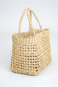 Side view of hand woven rattan basket highlighting its woven design