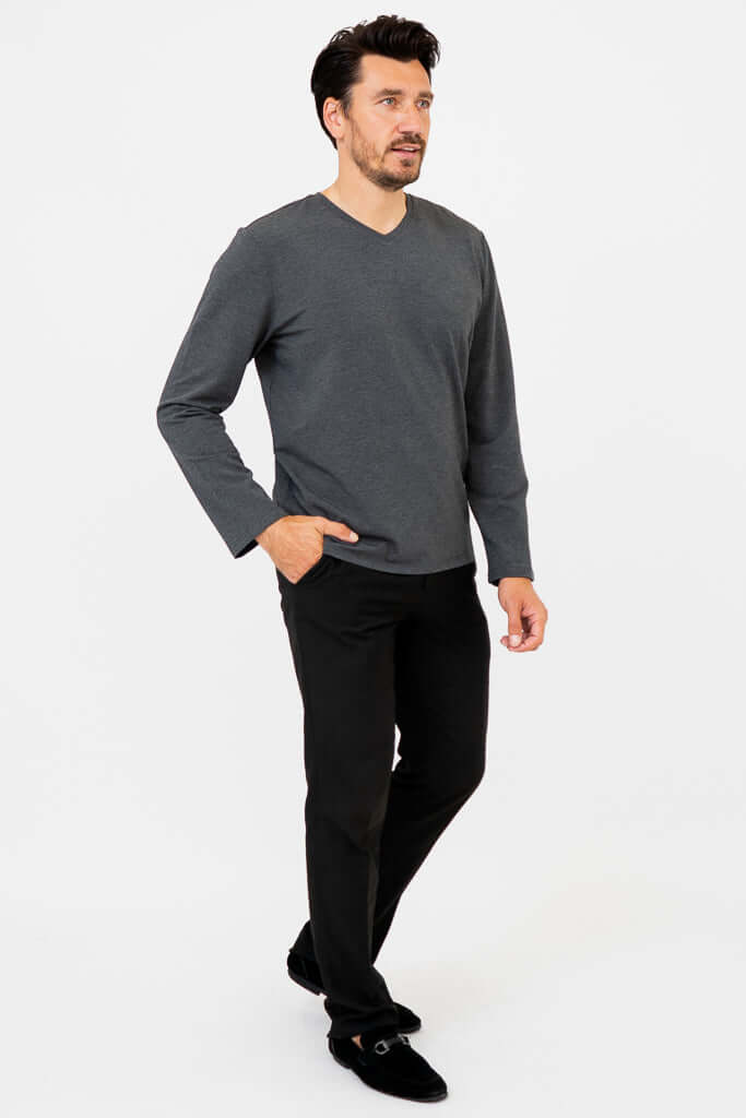 Side front view of man in charcoal V-neck long sleeve shirt