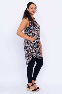 Side view of model in sleeveless leopard print tunic with high-low hemline