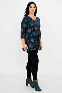 Side angle of model in Vana Tunic, highlighting A-line silhouette and pattern