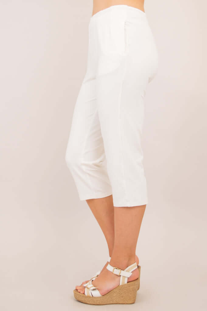 Side profile of Susan Capri pants in white showing the straight leg cut