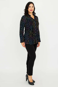 Side view of Cindy smocked dot shirt on model with black pants