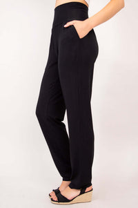 Side view of Clair black bamboo pants highlighting stretch waistband and relaxed fit