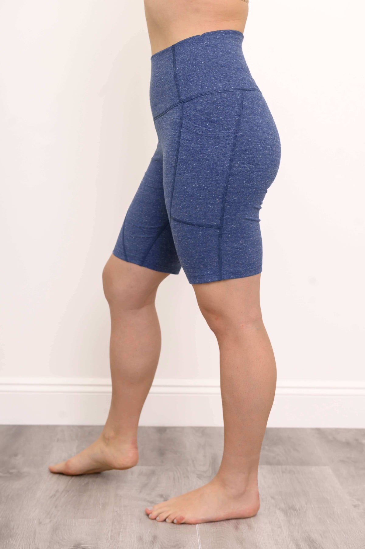 Side view of blue Robson Shorts displaying seam structure and fit