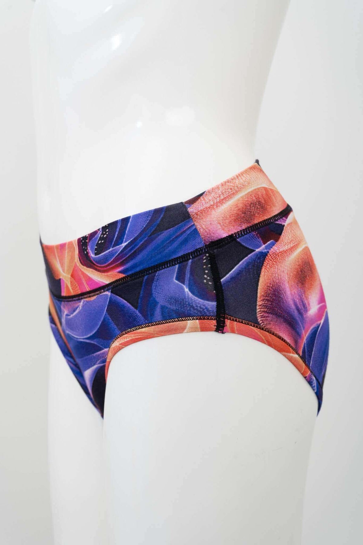 Side view of bamboo hipster brief with vibrant opal swirl design