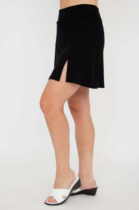 Side view of black Melly skort showing high waist and side slit