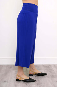 Side view of blue cropped palazzo capri pants with wide waistband