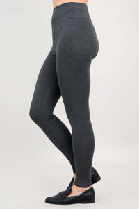 Side view of charcoal Riley leggings highlighting fit and stretch