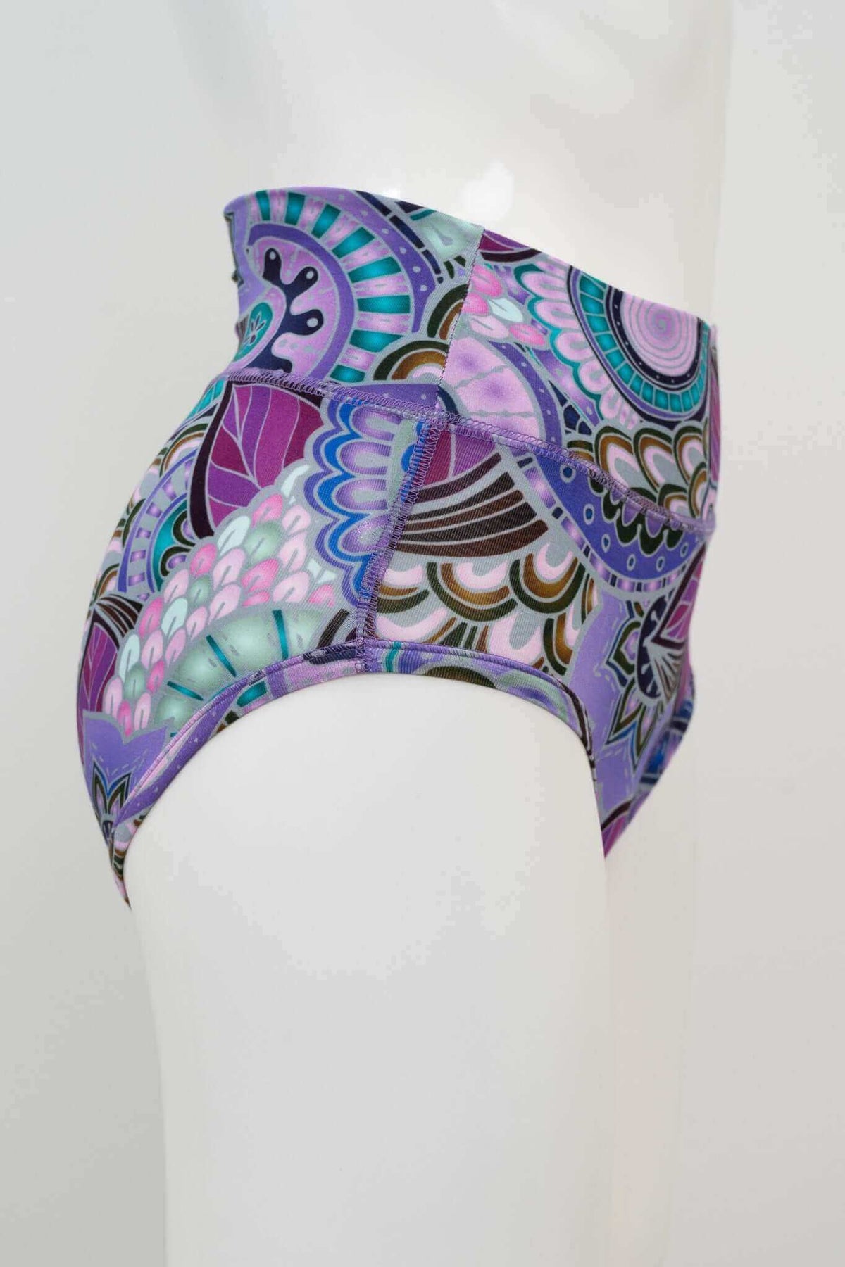 Side view of high-waisted brief with colorful mandala and floral patterns