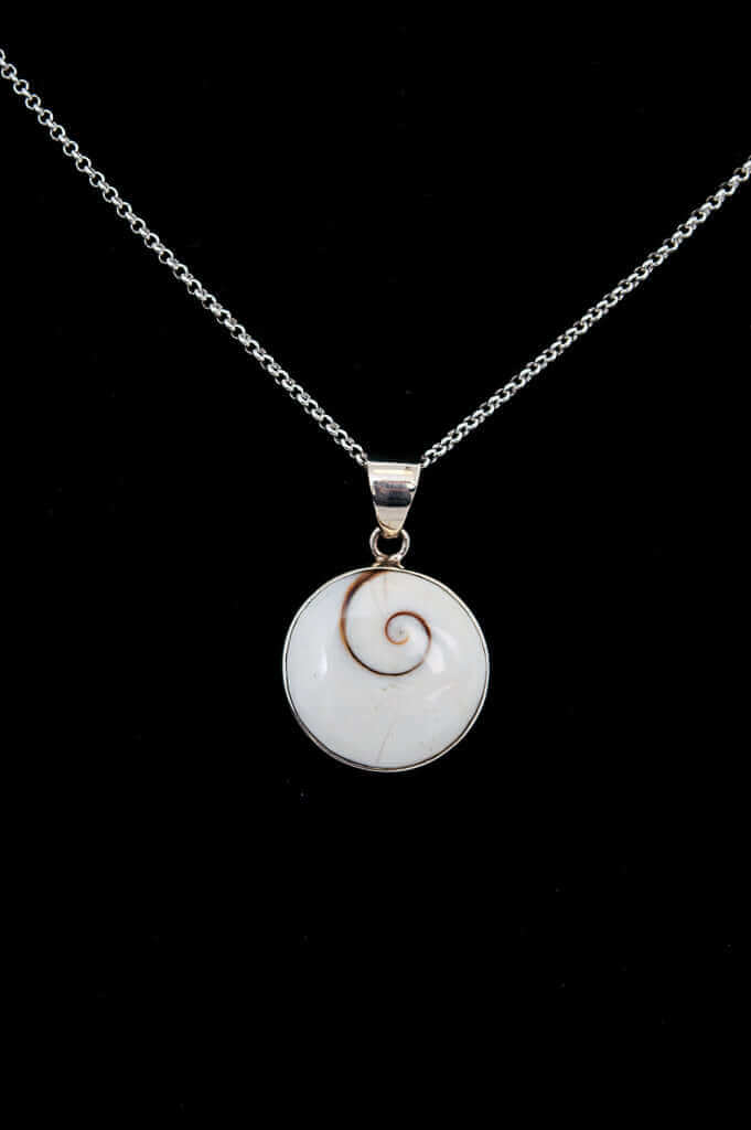 Sterling silver necklace with a round Shiva Eye pendant on a black background