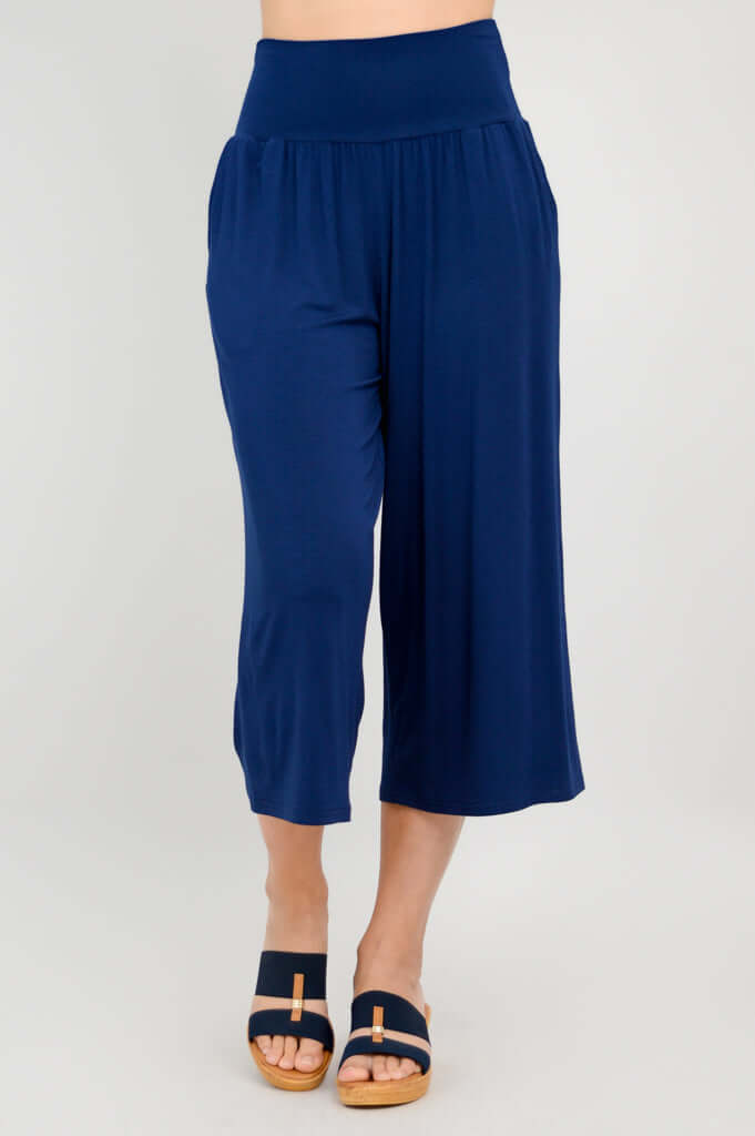 Straight-on view of royal blue gaylene capri pants showing flowy bamboo fabric