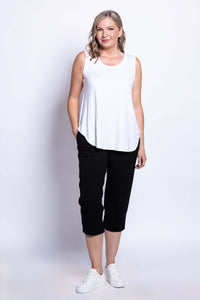 Model wearing Susan Capri black pants with white tank top, front view