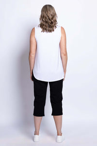 Model showing back view of Susan Capri pants with white tank top