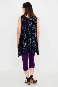 Back view of woman in Swing Tank Midnight Script showing elongated sides and A-line fit