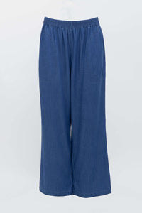Wide-leg blue denim Tencel pants displayed on a hanger against white background