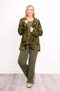 Woman posing in the Toucan Jacket, open style with 3/4 sleeves and green pants